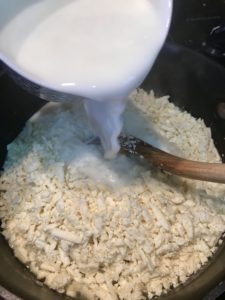 Adding queso fresco and hot milk