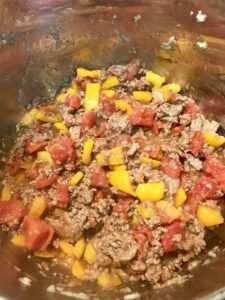 Ground beef with pepper, tomatoes and onions.