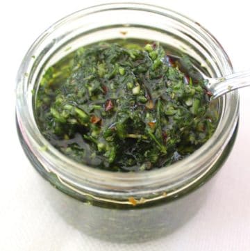 Argentinian Chimichurri sauce served in a glass jar.