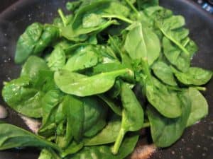 Cooking the spinach after the eggs