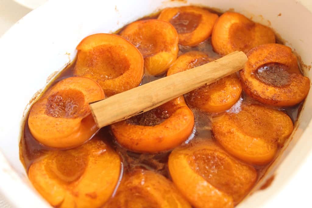 Baked Apricots dessert in buttery syrup and cinnamon.