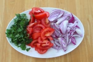 Chopped onions, tomatoes and cilantro for lomo saltado