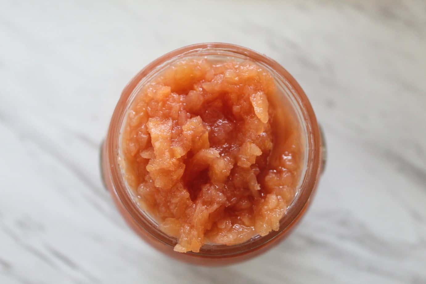 An overhead shot of quince jam in a jar.
