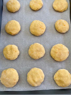 Cookies on a parchment paper, ready to bake. I keep them at least about an inch apart.