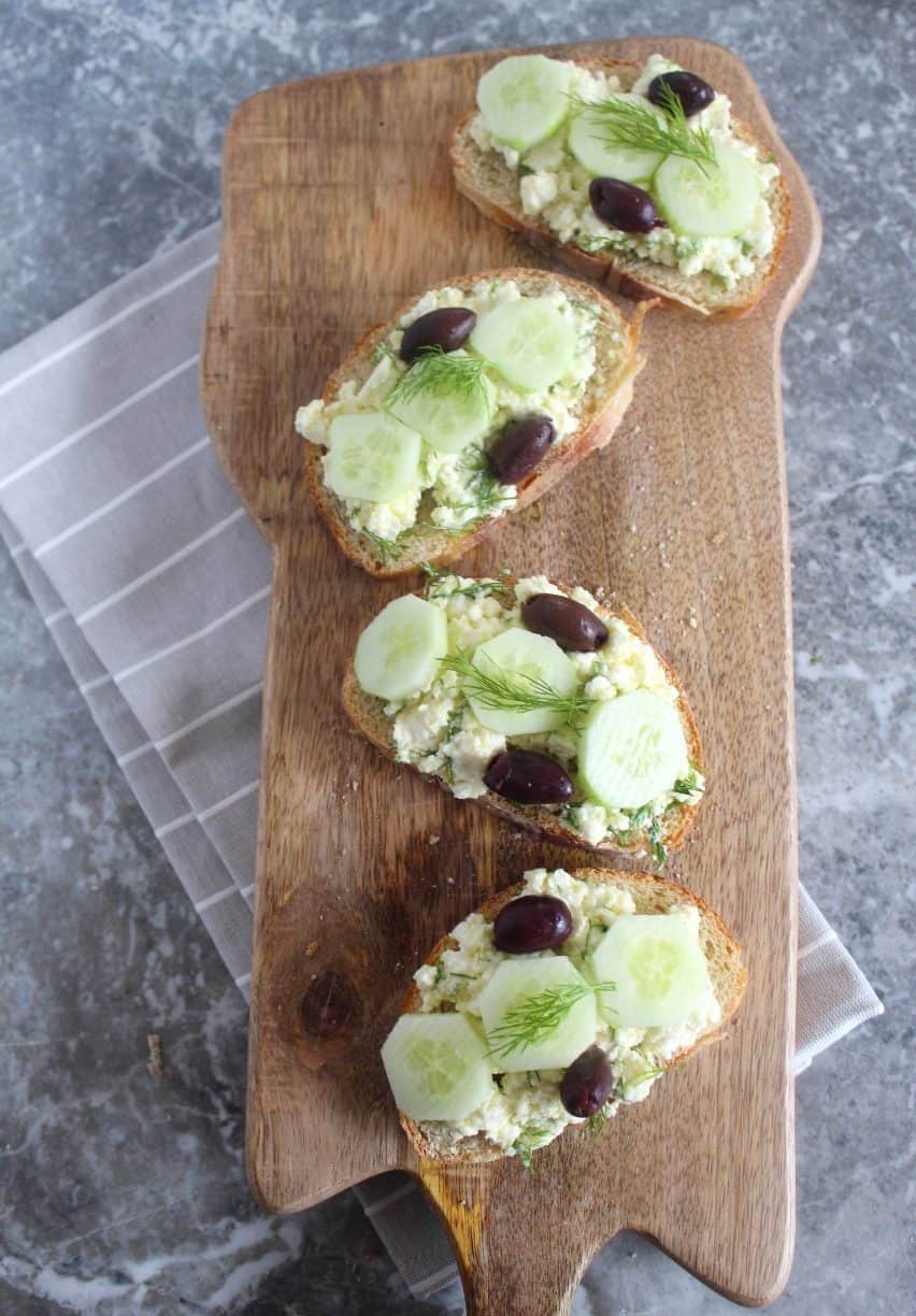 Mediterranean crostini served with feta cheese, olive oil, kalamata olives, cucumbers and fill.