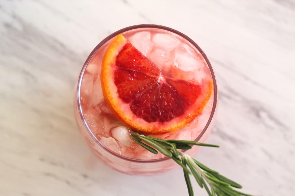 Vodka Cocktail with Blood Oranges and Rosemary, served over crushed ice.