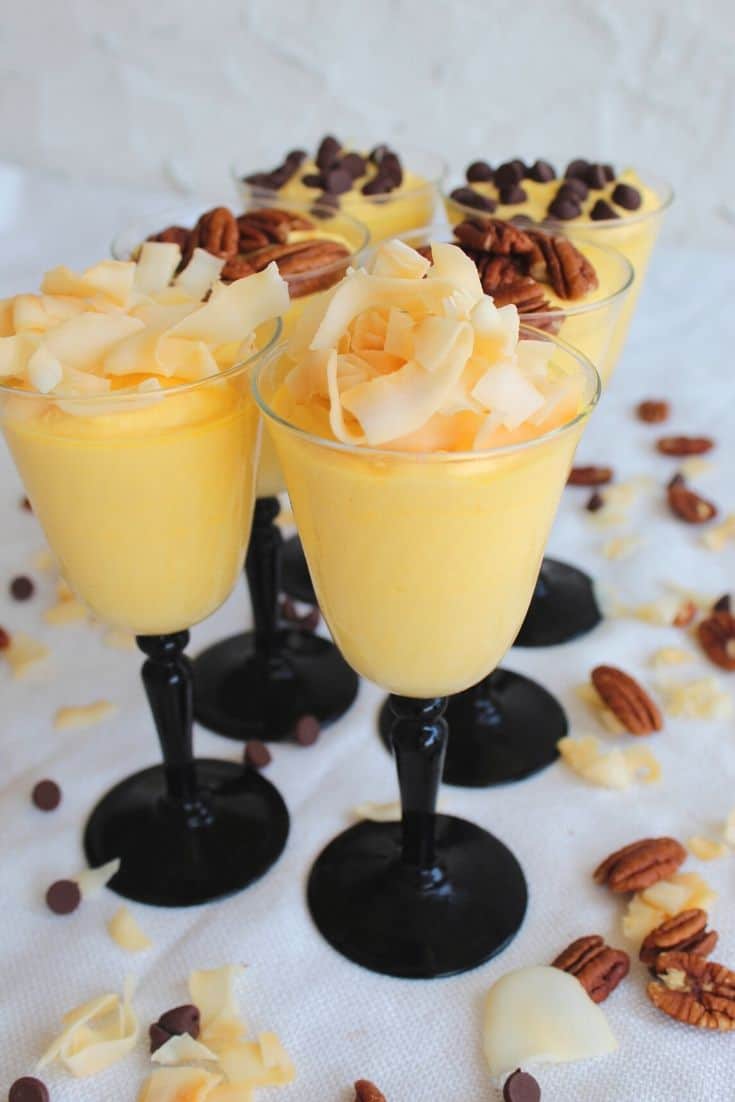Tropical Mango Mousse served with Coconut Chips, Pecans and Chocolate Chips Toppings