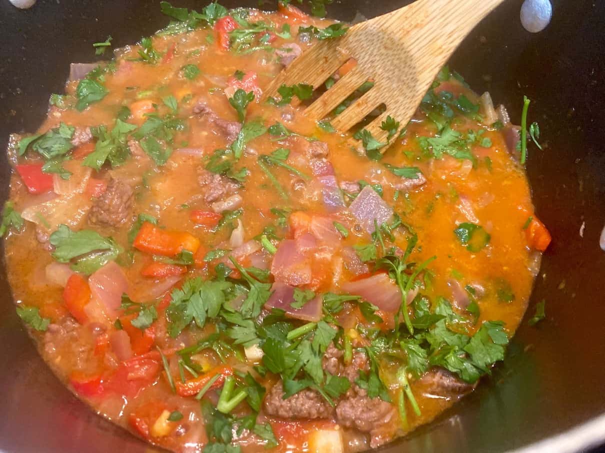 Add chopped fresh parsley to the sauce.