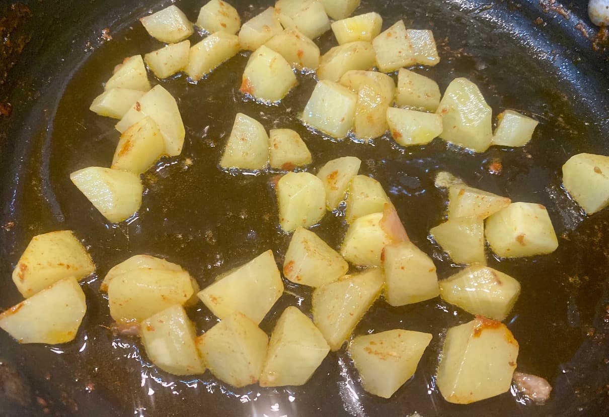 Saute diced potatoes
