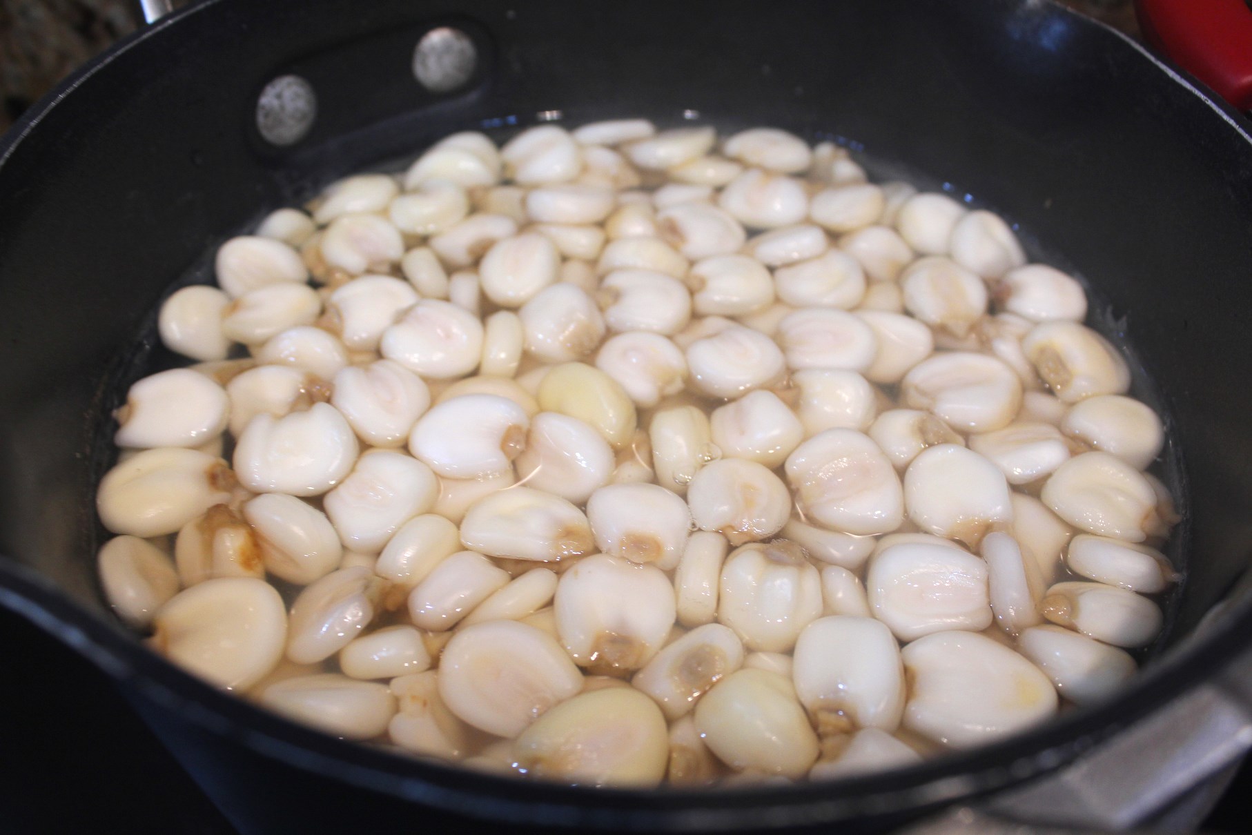 A pot of water and mote grains, ready to cook