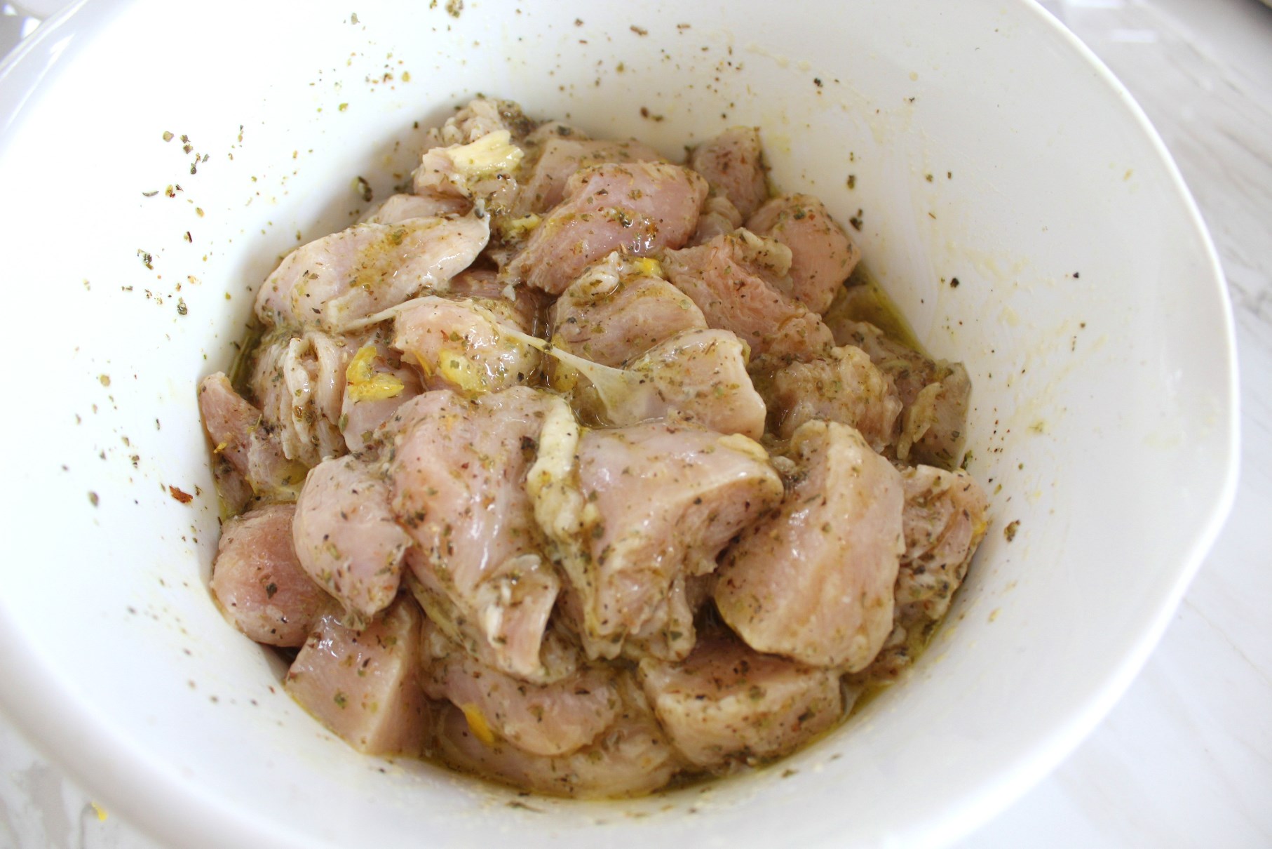 Chicken in marinade inside a bowl