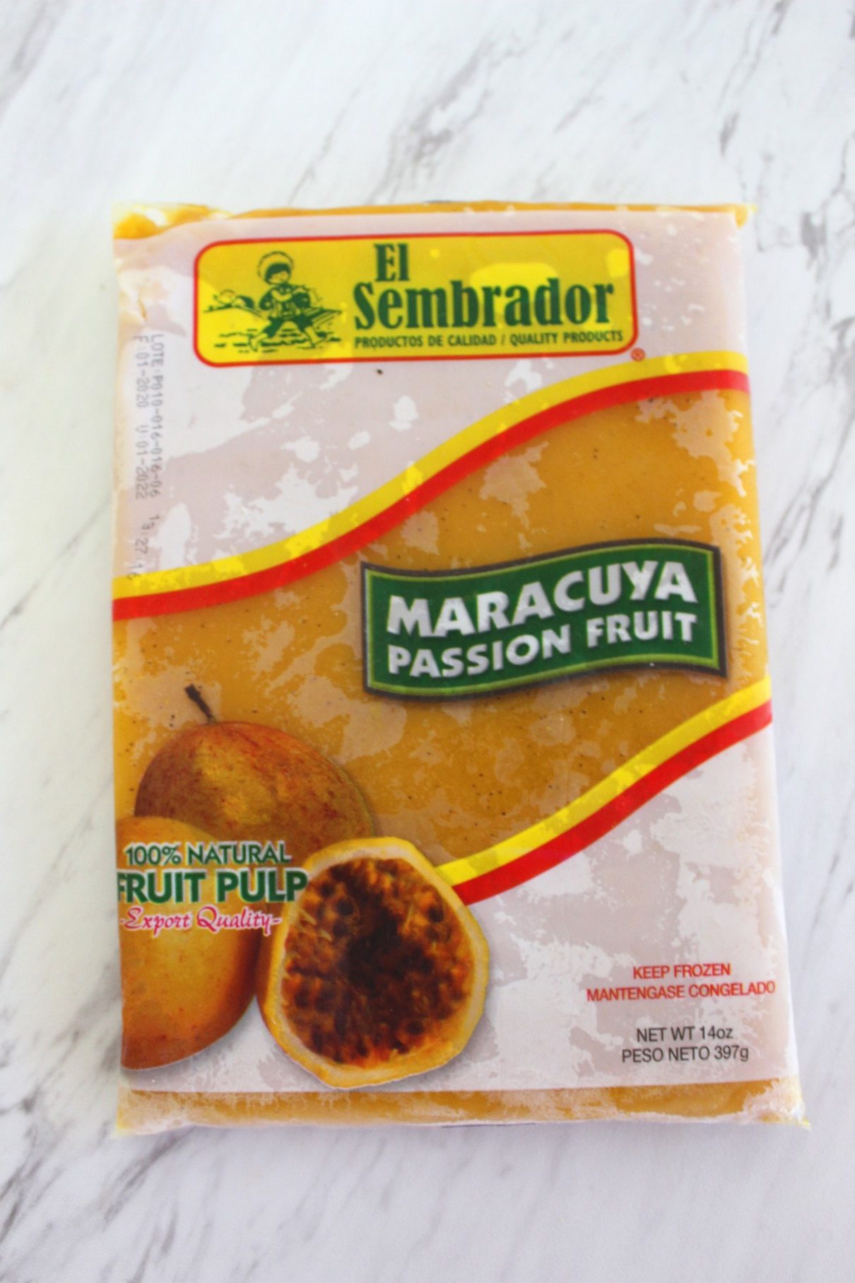 A frozen bag of fruit pulp, it says Maracuya & Passion Fruit.
