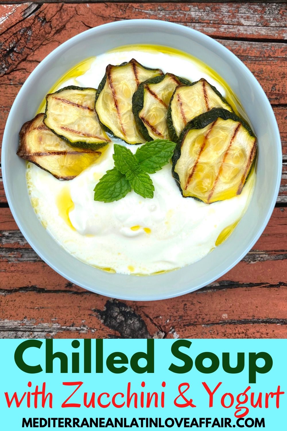 An image prepared for Pinterest with the picture of the food and the title in the bottom that reads: Chilled Soup with Zucchini & Yogurt. Picture shows a bowl of the yogurt soup garnished with zucchini slices and mint leaves.