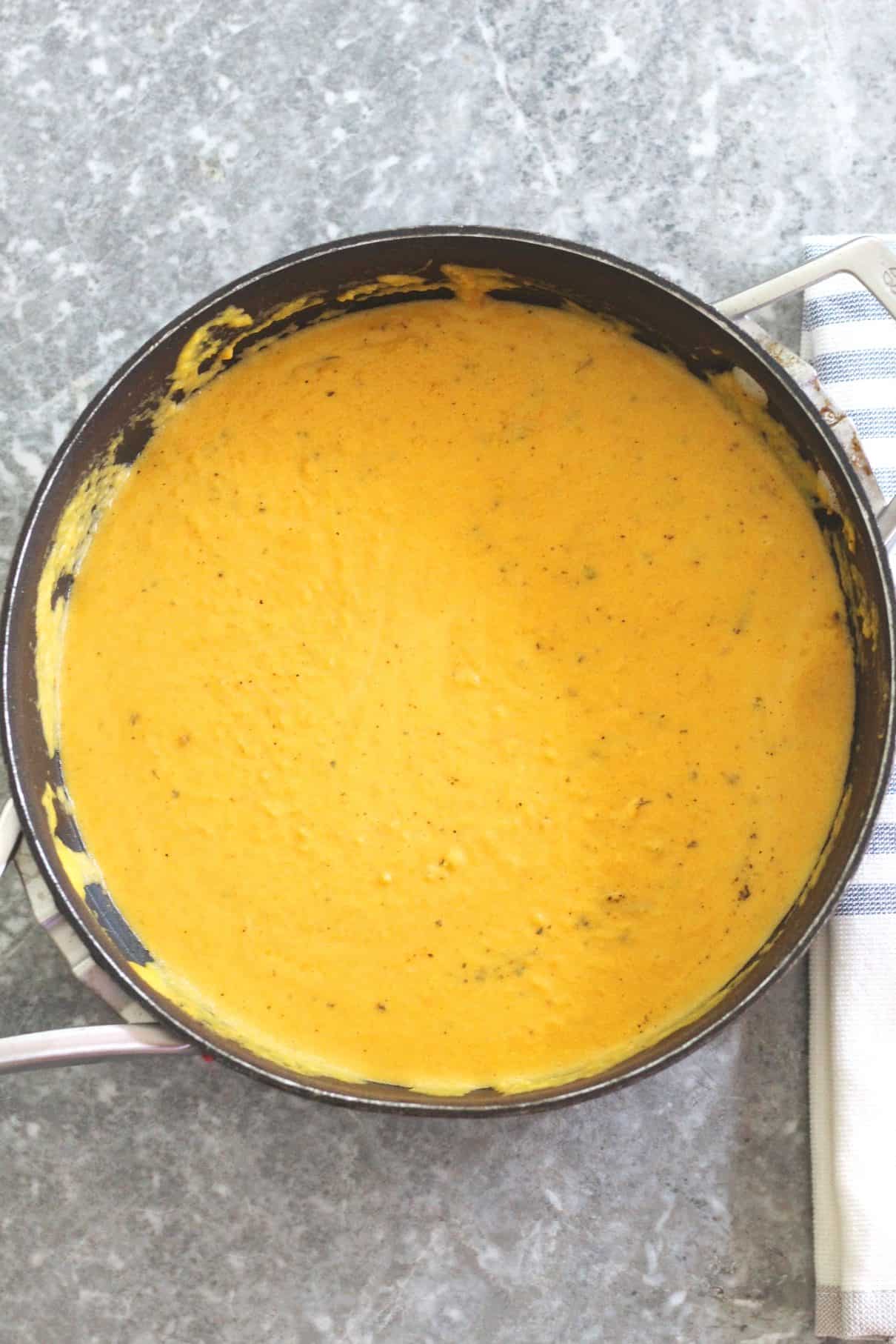 A pan with butternut squash sauce