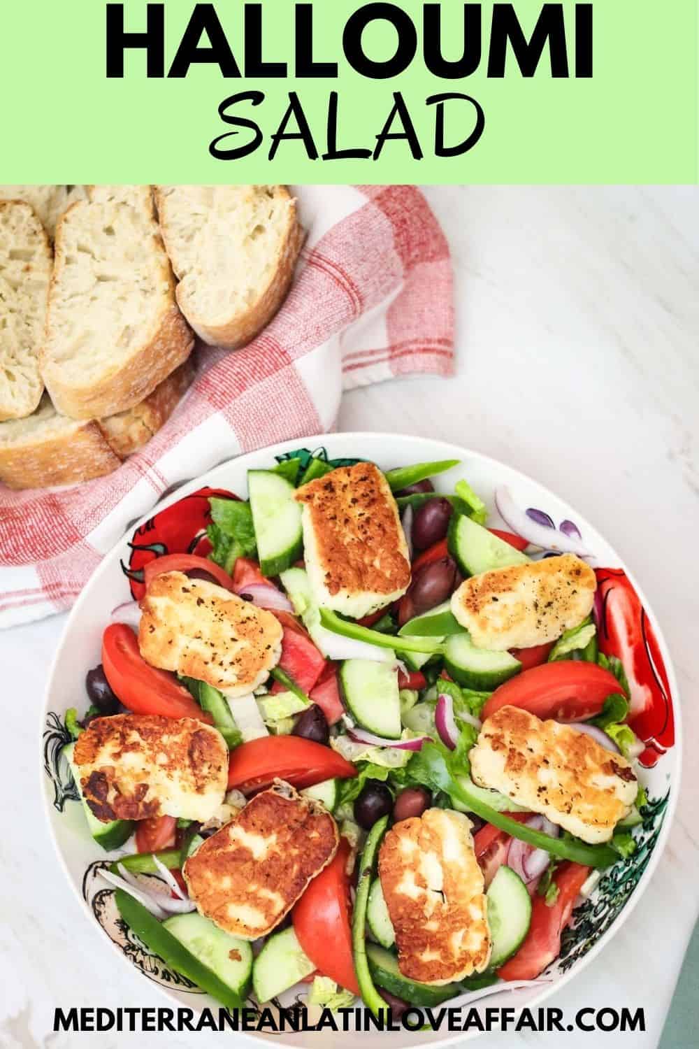 A vegetable salad with fried halloumi cheese shown next to a basket of bread. #mediterraneanlatinloveaffair, #salad, #halloumi