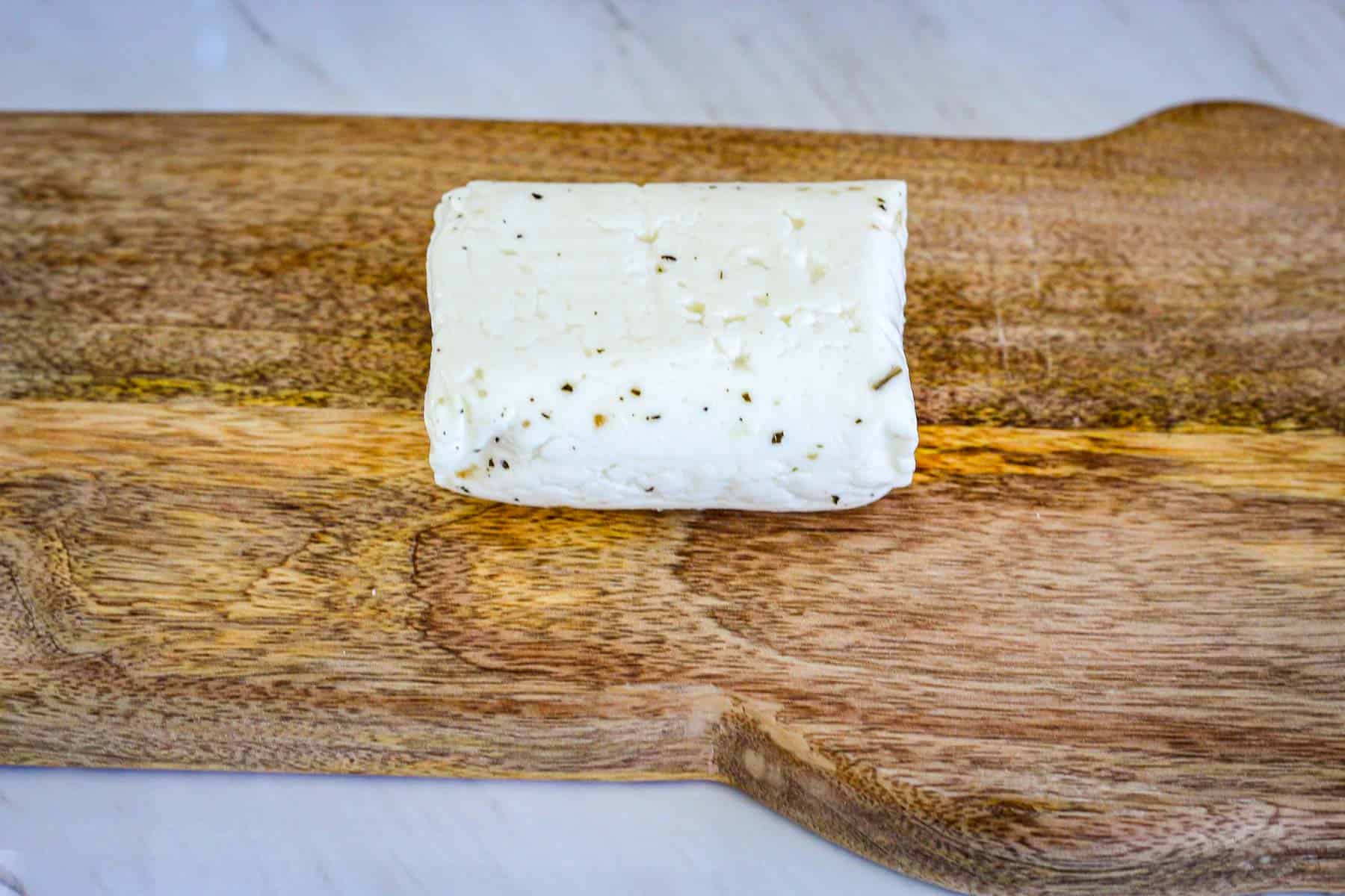 Halloumi cheese on a cutting board.