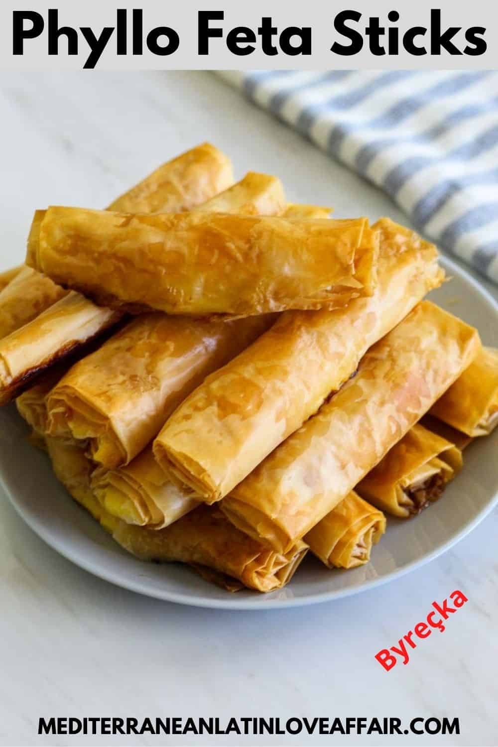 An image prepared for Pinterest. It shows the phyllo feta sticks on a serving platter piled up on top of each other. Then there's a title bar on top of the image and the website link in the bottom. #byrek #borek #burek #mediterraneanlatinloveaffair