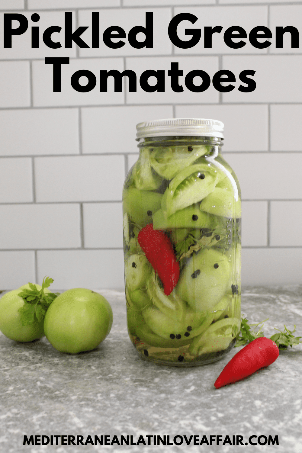 An image prepared for Pinterest, it shows a large mason jar of pickled green tomatoes. The image has a title bar on top and the website link in the bottom.