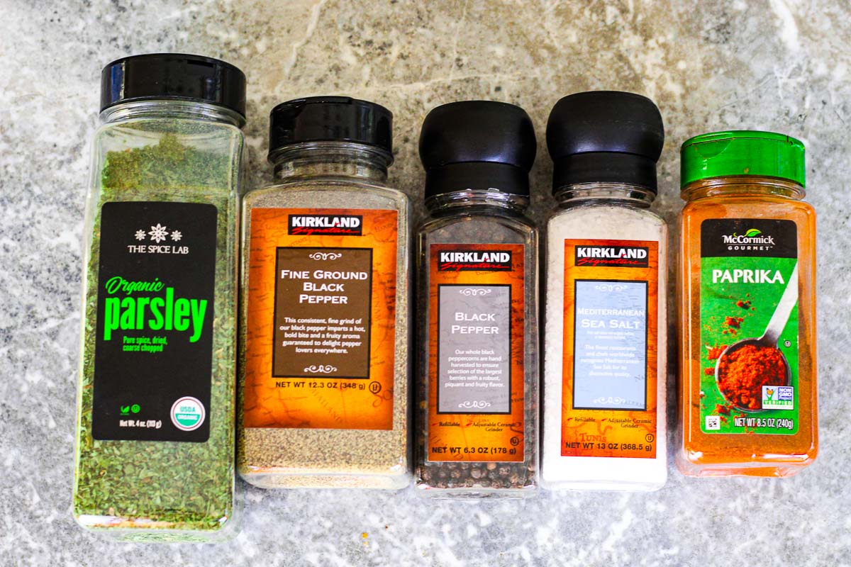 Spices from Costco: Parsley, fine ground black pepper, black pepper with grinder, Mediterranean Sea Salt, paprika.
