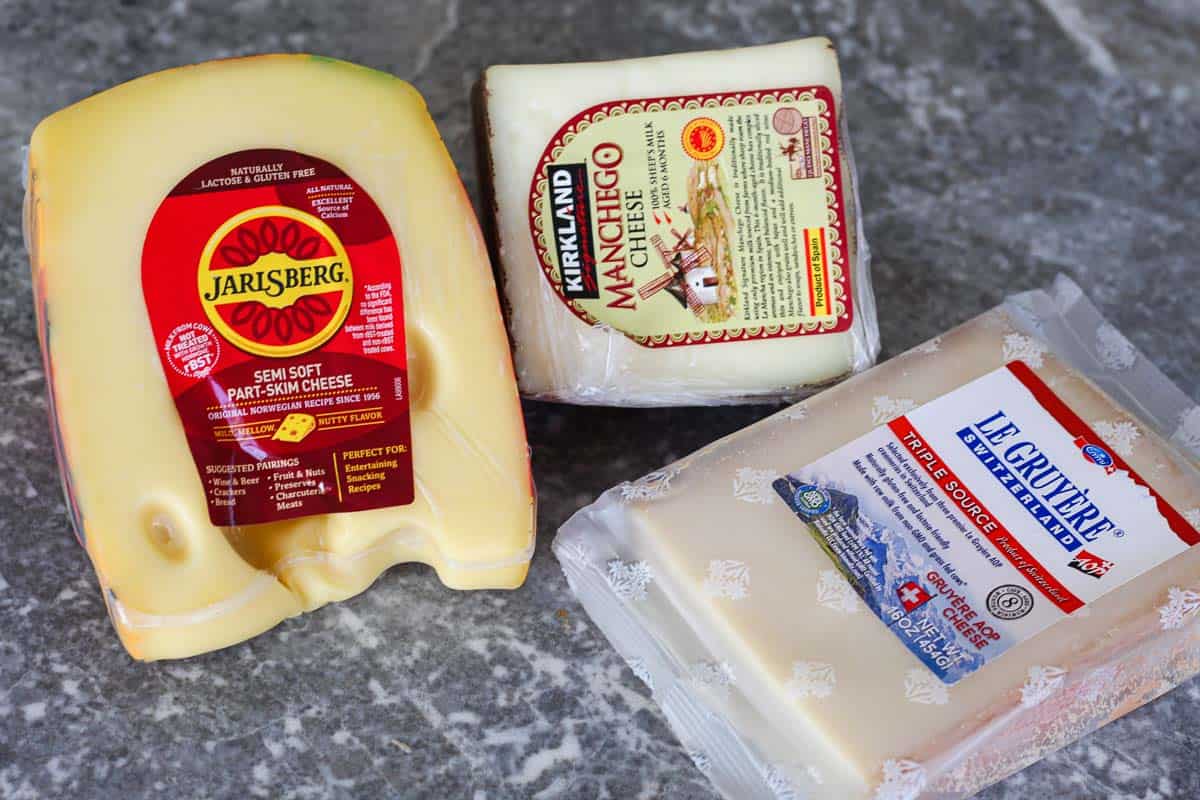 3 of my favorite cheeses from Costco: Jarslberg cheese, Manchego cheese and Gruyere cheese.