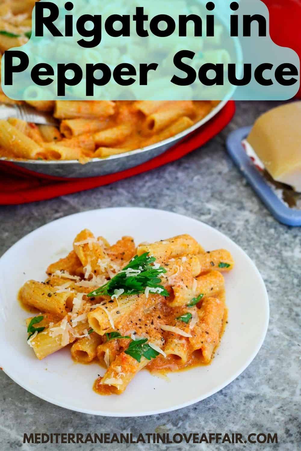 An image prepared for Pinterest. It shows the picture of a serving of rigatoni in a pepper sauce, topped with grated cheese and parsley. In the background is the pan with the food cooked for the whole family. On top of the picture there's a title bar and on the bottom a website link.