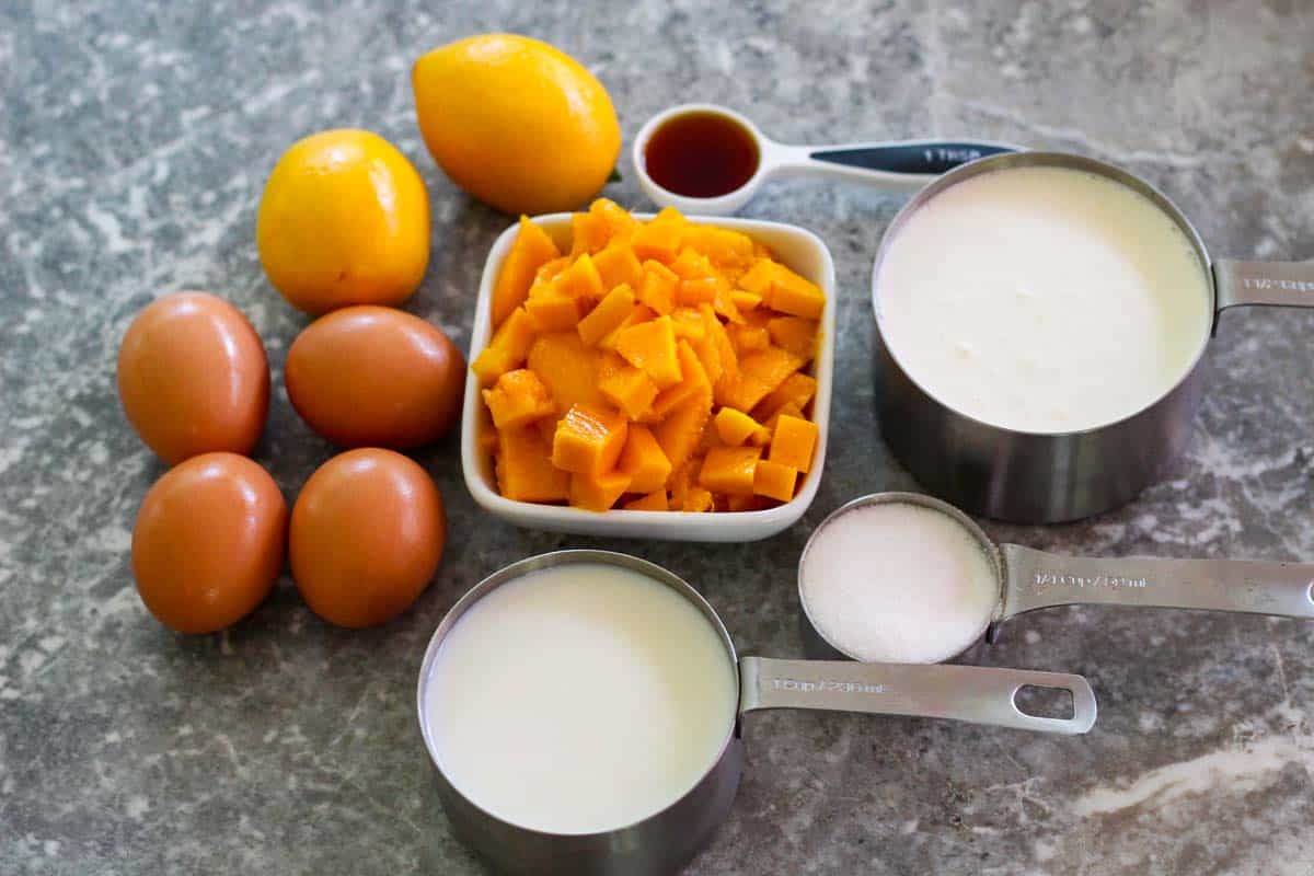 Ingredients for making mango/meyer lemon gelato: meyer lemons, eggs, mango, milk, heavy cream, sugar and vanilla extract.