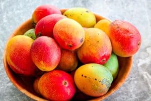 A basket full of ripe mangoes.