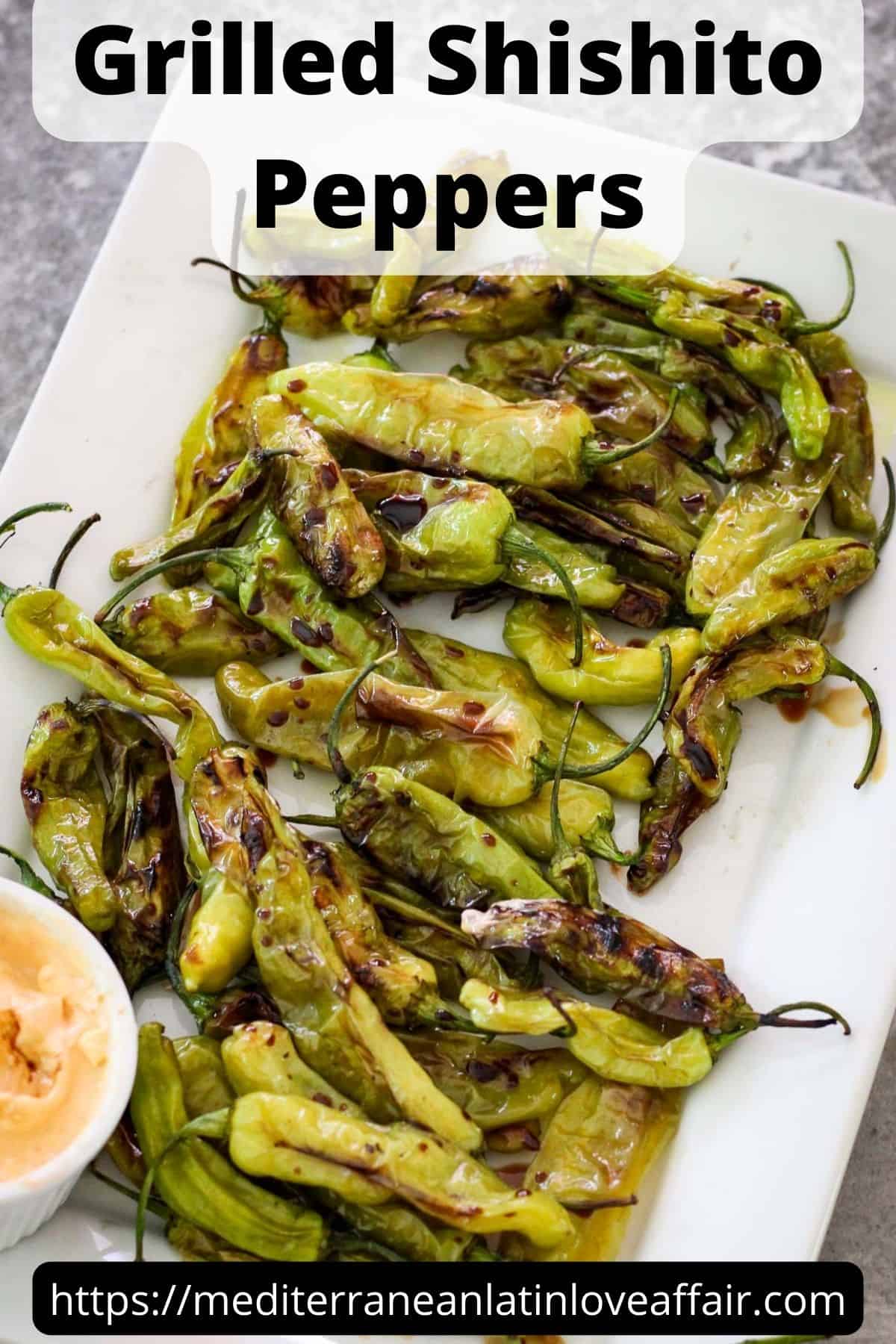 An image prepared for Pinterest. It shows a picture of grilled shishito peppers in a serving tray. There's a dip on the side of the peppers. On top of the picture there's a title bar that says Grilled Shishito Peppers and on the bottom there's a website link. 