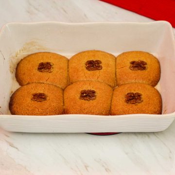 A baking dish showing Albanian sheqerpare cookies just baked.