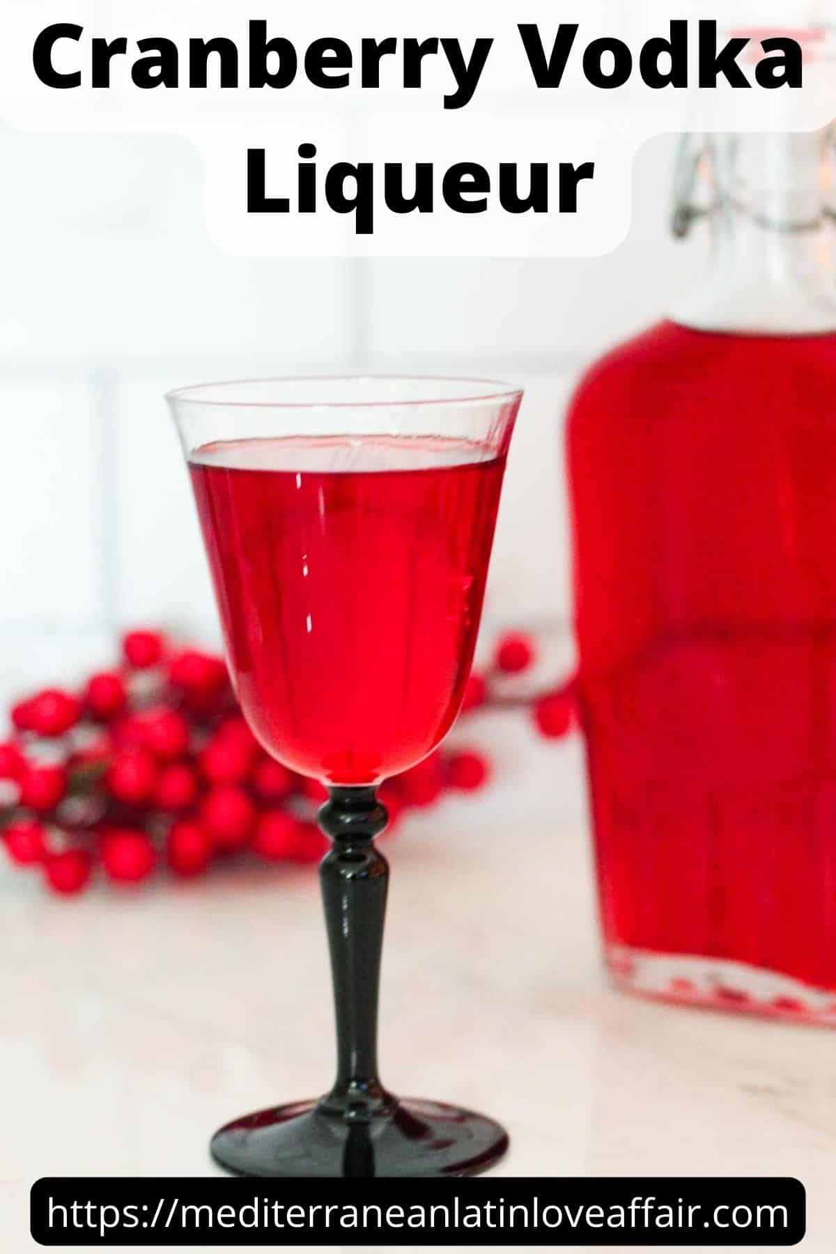 An image created for Pinterest. It shows the picture of a bottle of cranberry liqueur and a glass with liqueur in it. Then there's a title bar with the name of the liqueur and a bottom bar with the website link. 