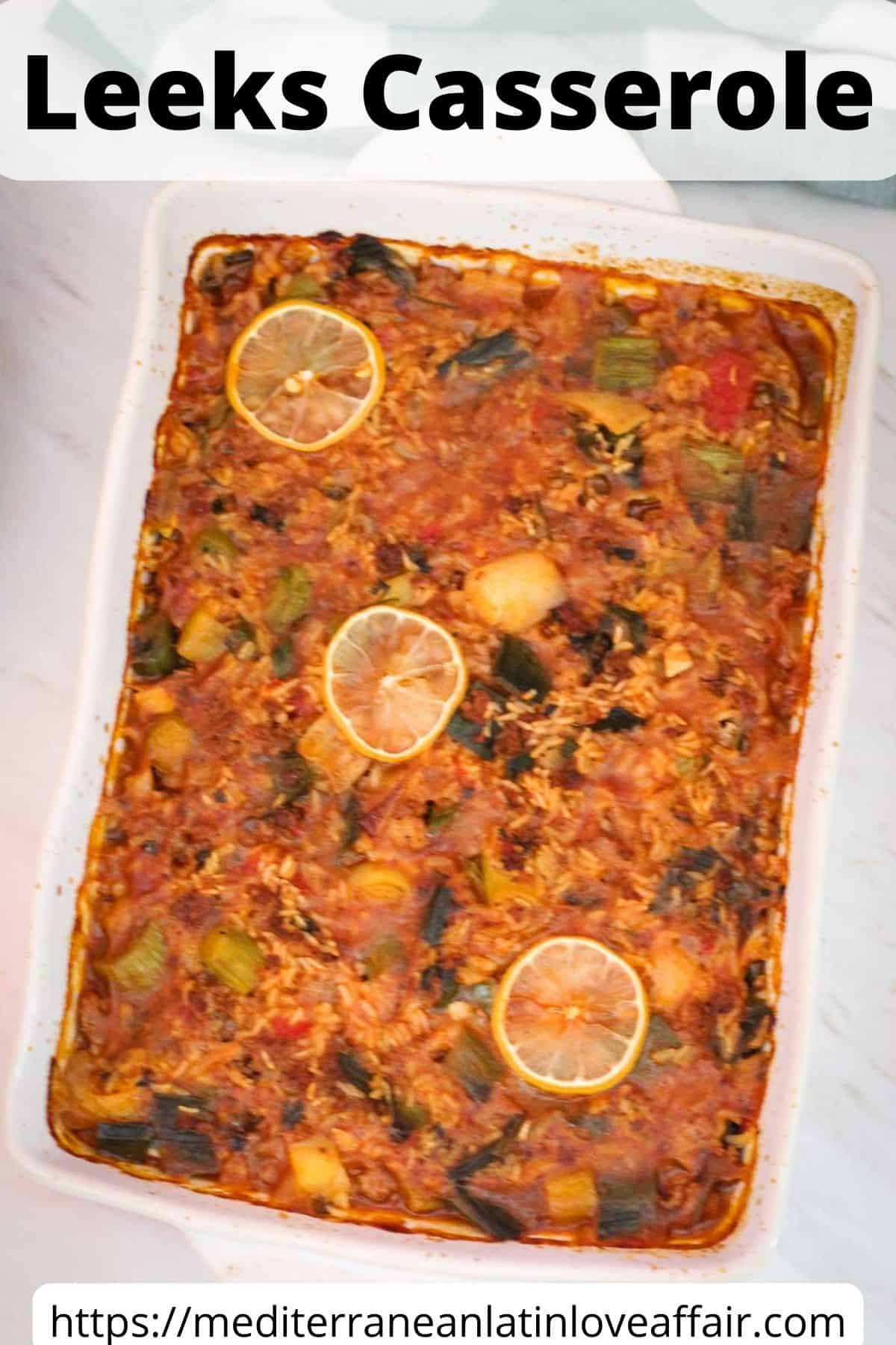 An image prepared for Pinterest that shows a picture of leeks casserole with lemon slices in the center. There's a title bar on top and a website link in the bottom. 