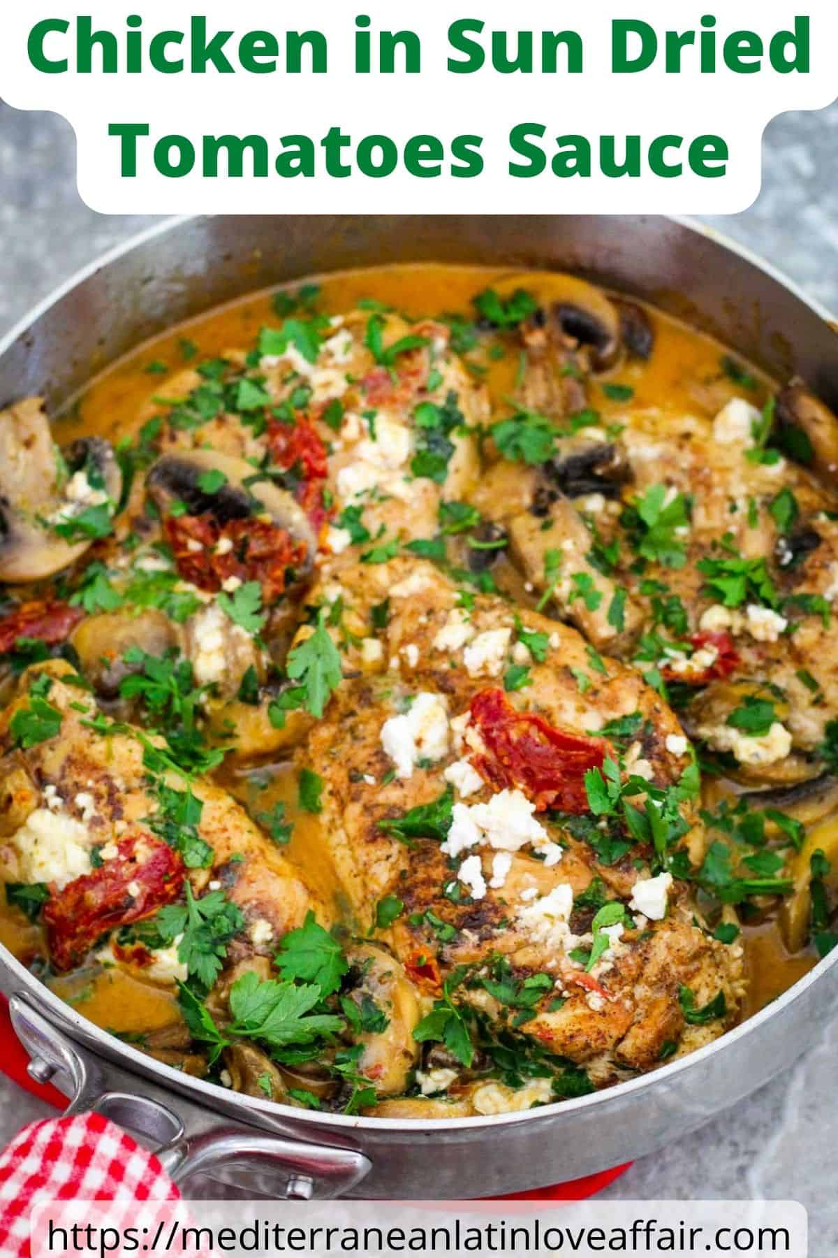 An image prepared for Pinterest. It shows a picture of the cooked chicken in creamy sun dried tomatoes sauce with mushrooms. Food is garnished with feta and parsley. There's a title bar on top and a website link at the bottom.