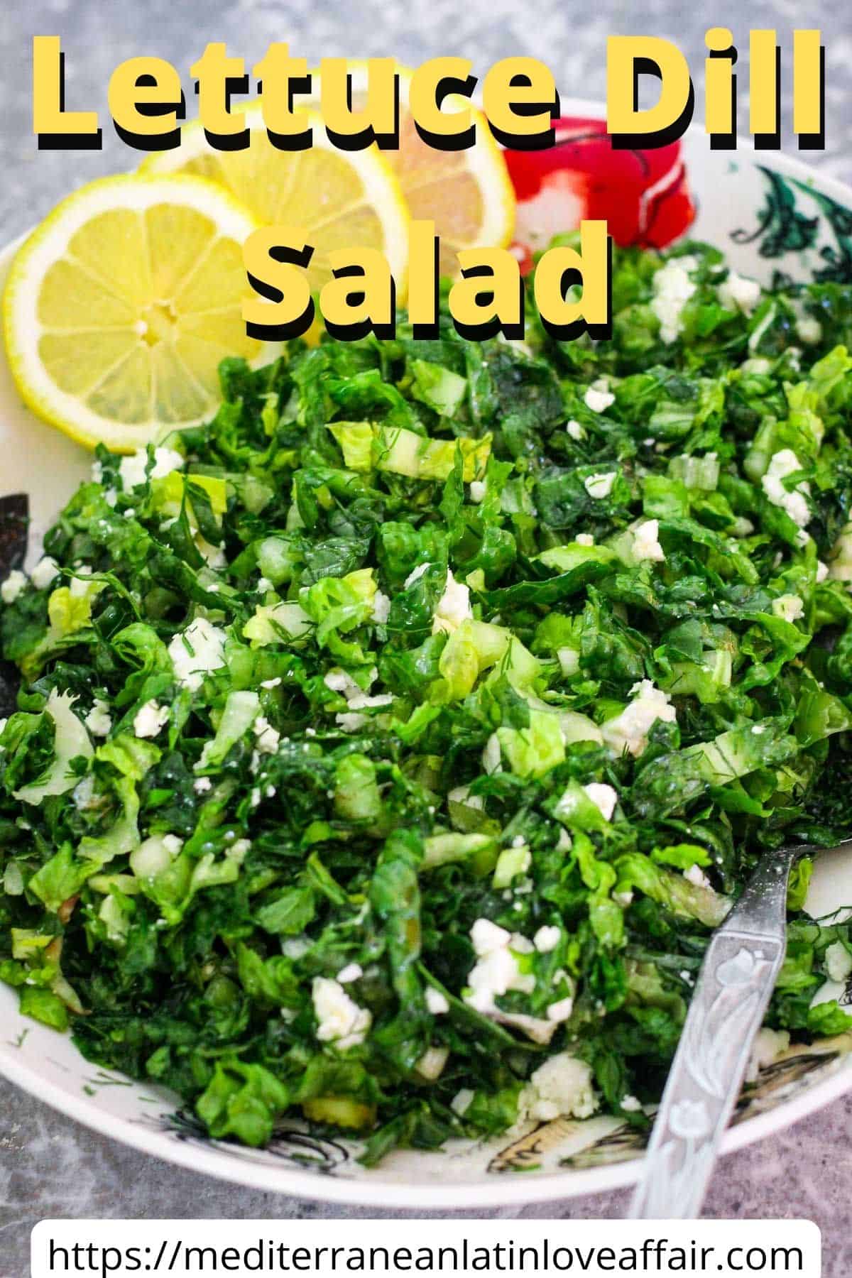 An image prepared for Pinterest, it shows a lettuce dill salad with feta cheese and lemon slices on a salad bowl. There's a title bar on top and a website link at the bottom.