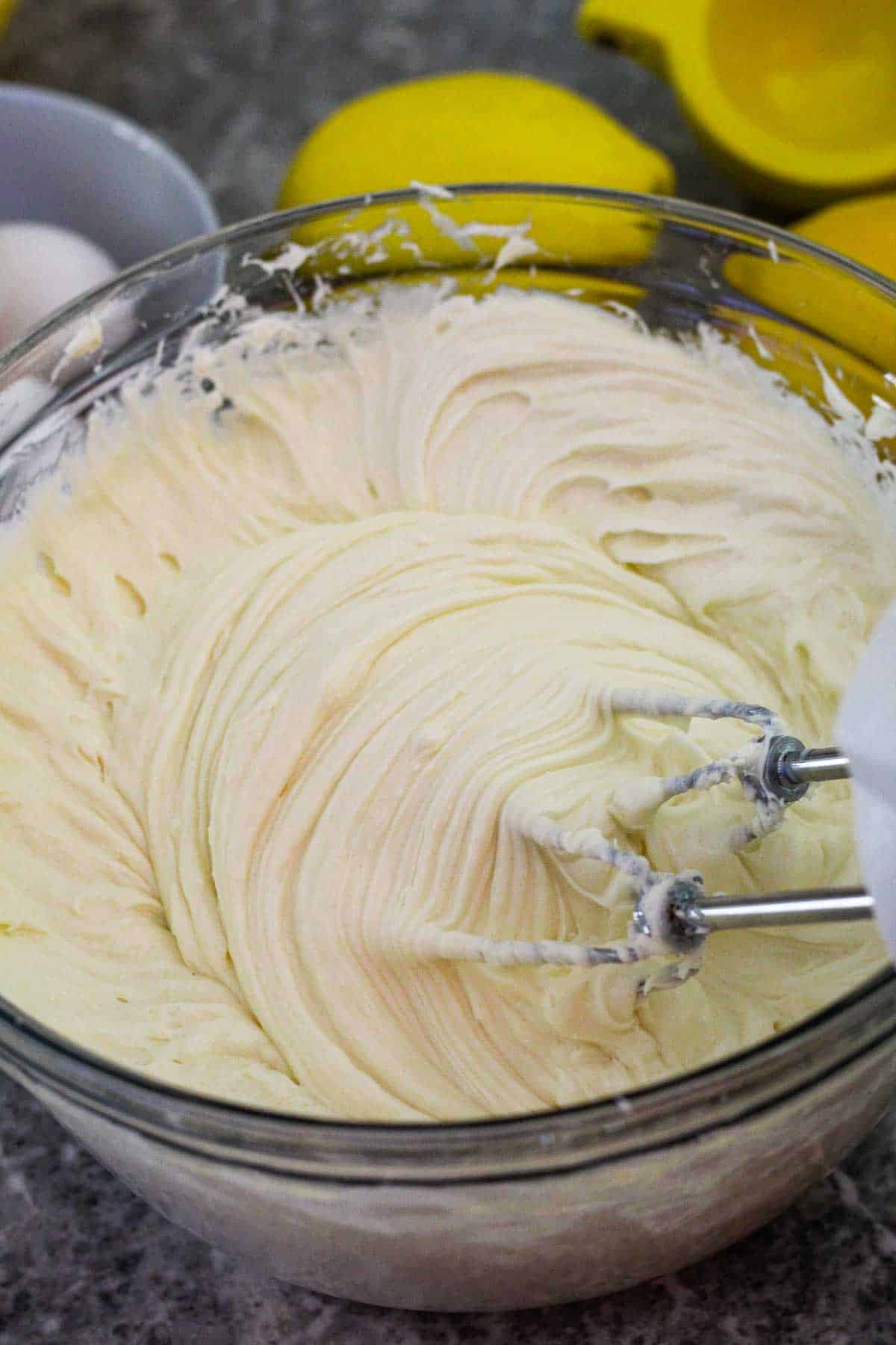 Whipping cream cheese, vanilla and lemon extract. 