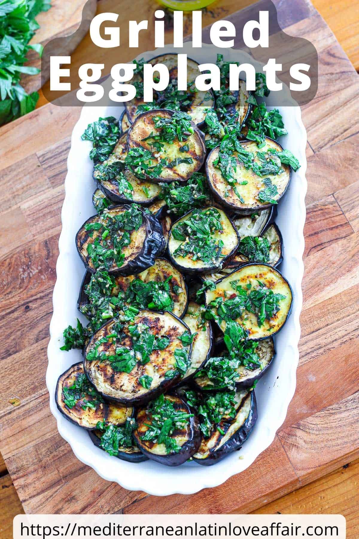 An image prepared for Pinterest. It shows a picture of the grilled eggplants on a platter covered with a herb like topping. Picture has a title bar on top and a website link at the bottom.