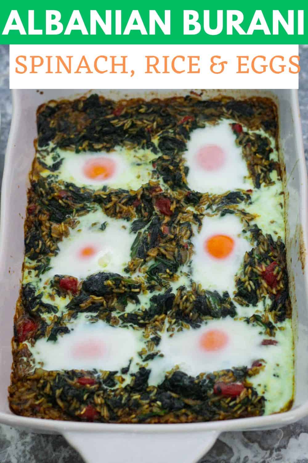 An image prepared for Pinterest, it shows a baked spinach dish with eggs on top. It has a title bar on top of the picture.