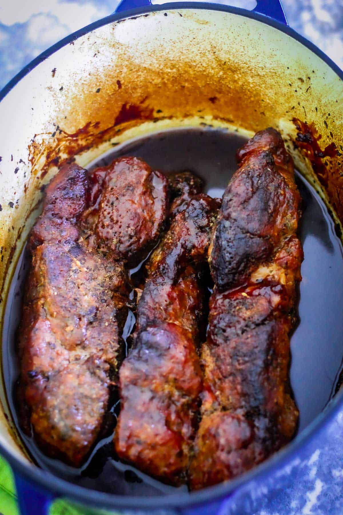 Country-style ribs braised and cooked in an oval Dutch Oven, still in the pot. 