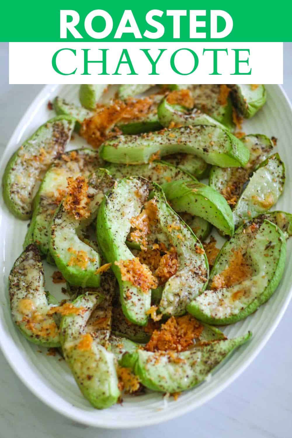 An image prepared for Pinterest, it shows a platter with roasted chayote squash, crispy parmesan and herbs over the slices. There's a title bar over the picture that reads Roasted Chayote.