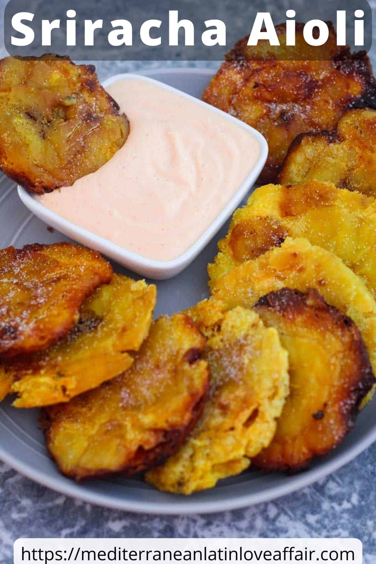 An image created for Pinterest, it shows a platter with fried tostones next to a square condiment bowl with sriracha aioli. Picture has a title bar on top and a website link at the bottom.