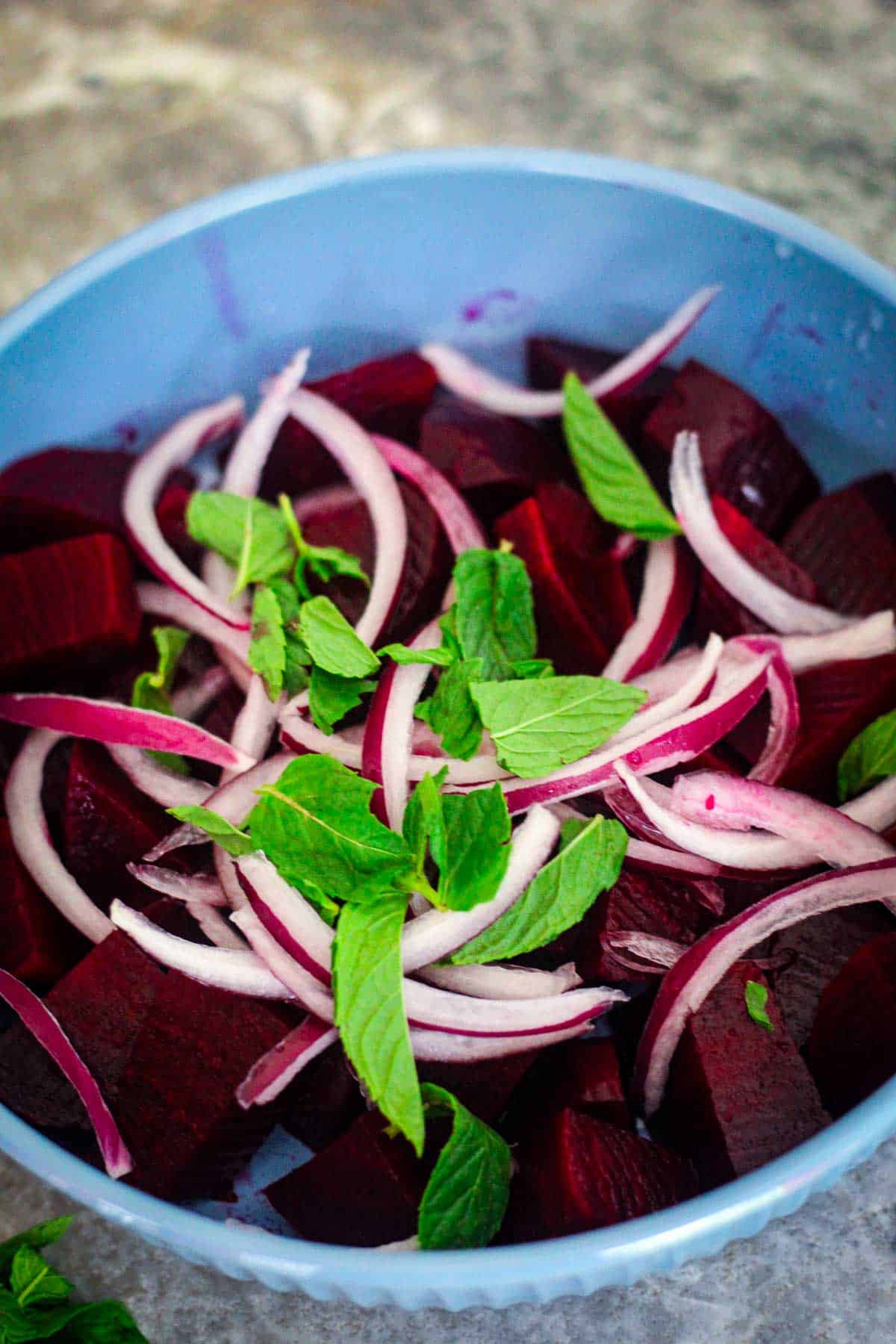 Beets with onions and mint, no vinaigrette is added yet.