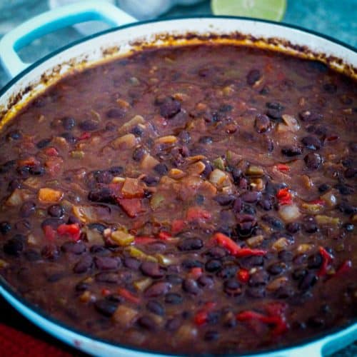Cuban black beans, cooked and shown on a round dutch oven.