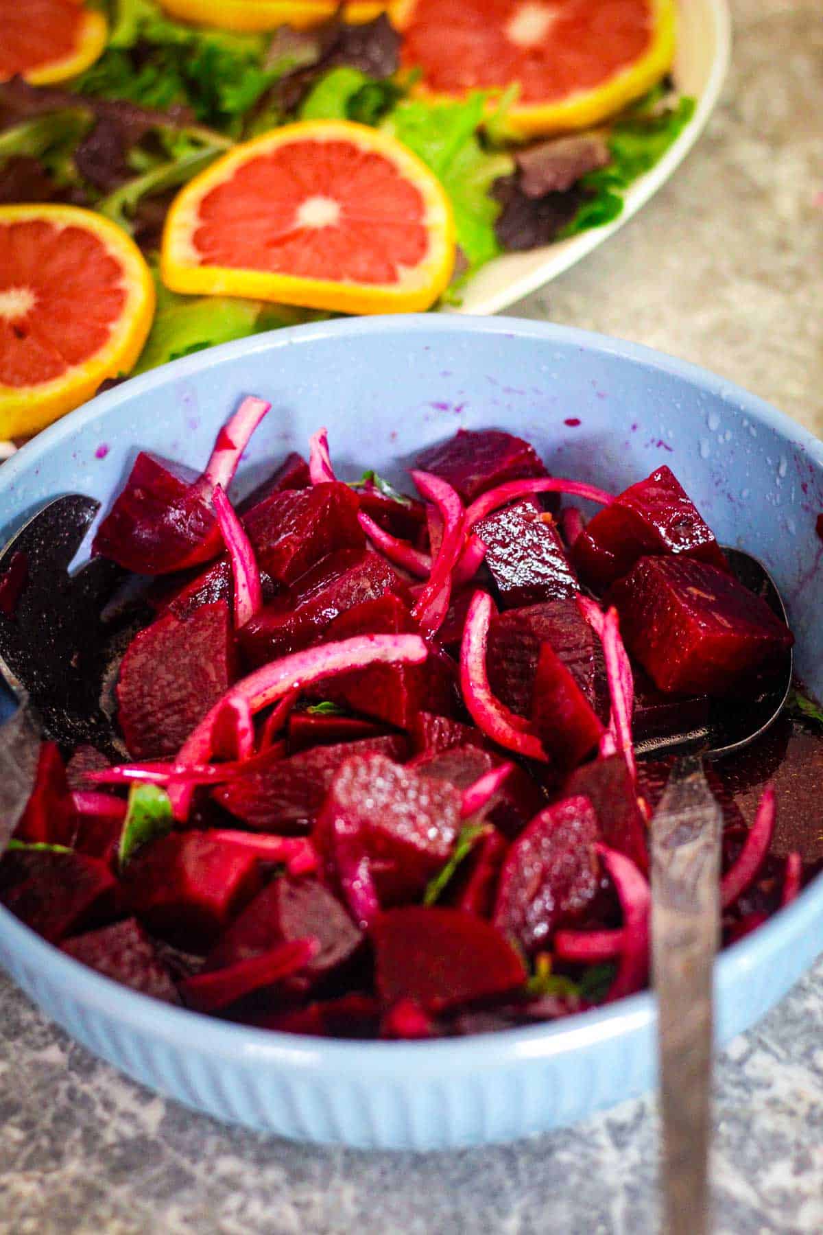 Beets, onions, mint mixed with vinaigrette so now everything is reddish in color and well coated with the vinaigrette, it's almost like a marinade. 
