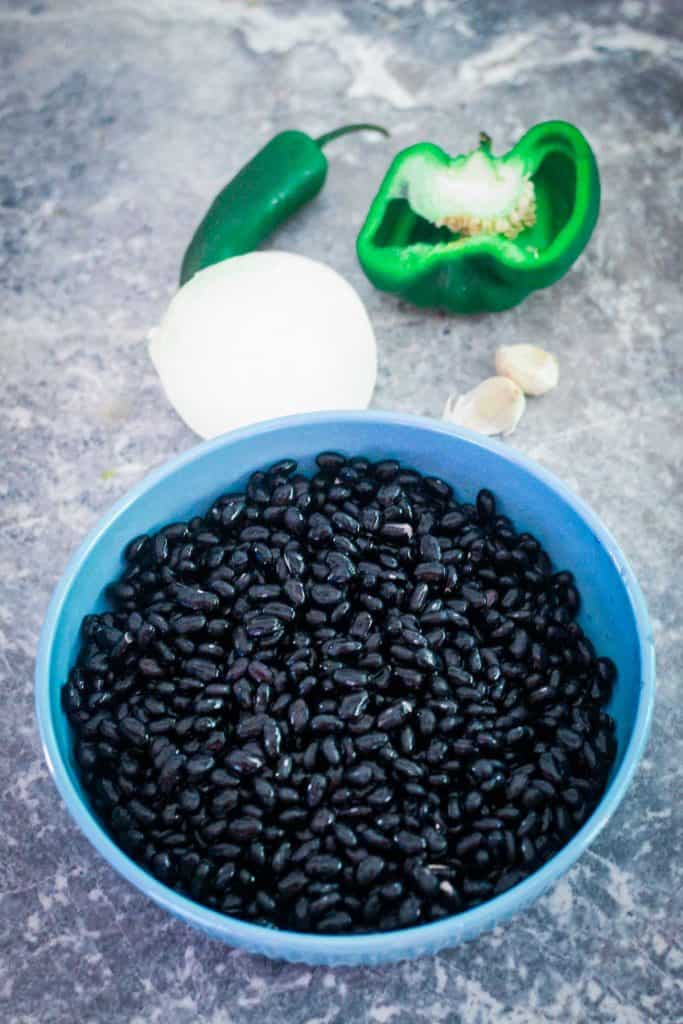 Ingredients to cook black beans in the pressure cooker.