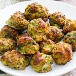 A platter with turkey meatballs that have been baked until golden brown.