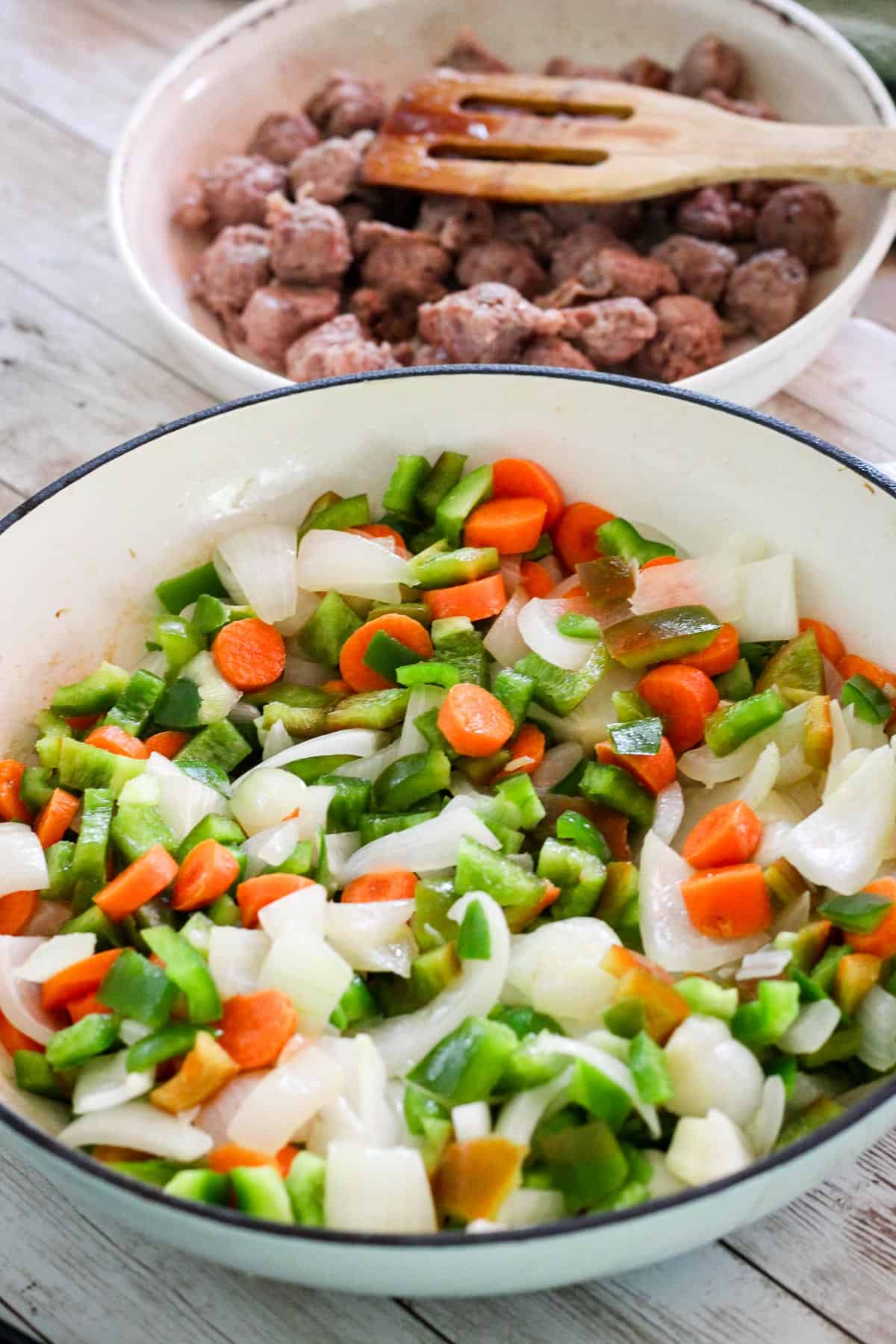 Sauteing onions and veggies together. 