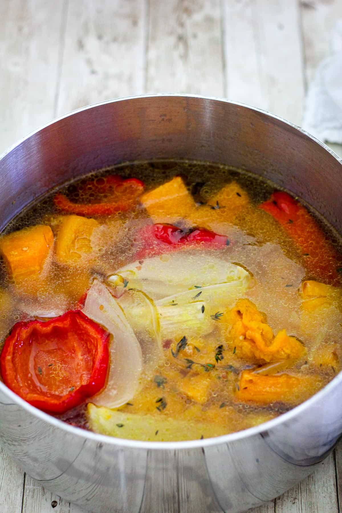 All the roasted veggies are inside a soup pot with broth! 