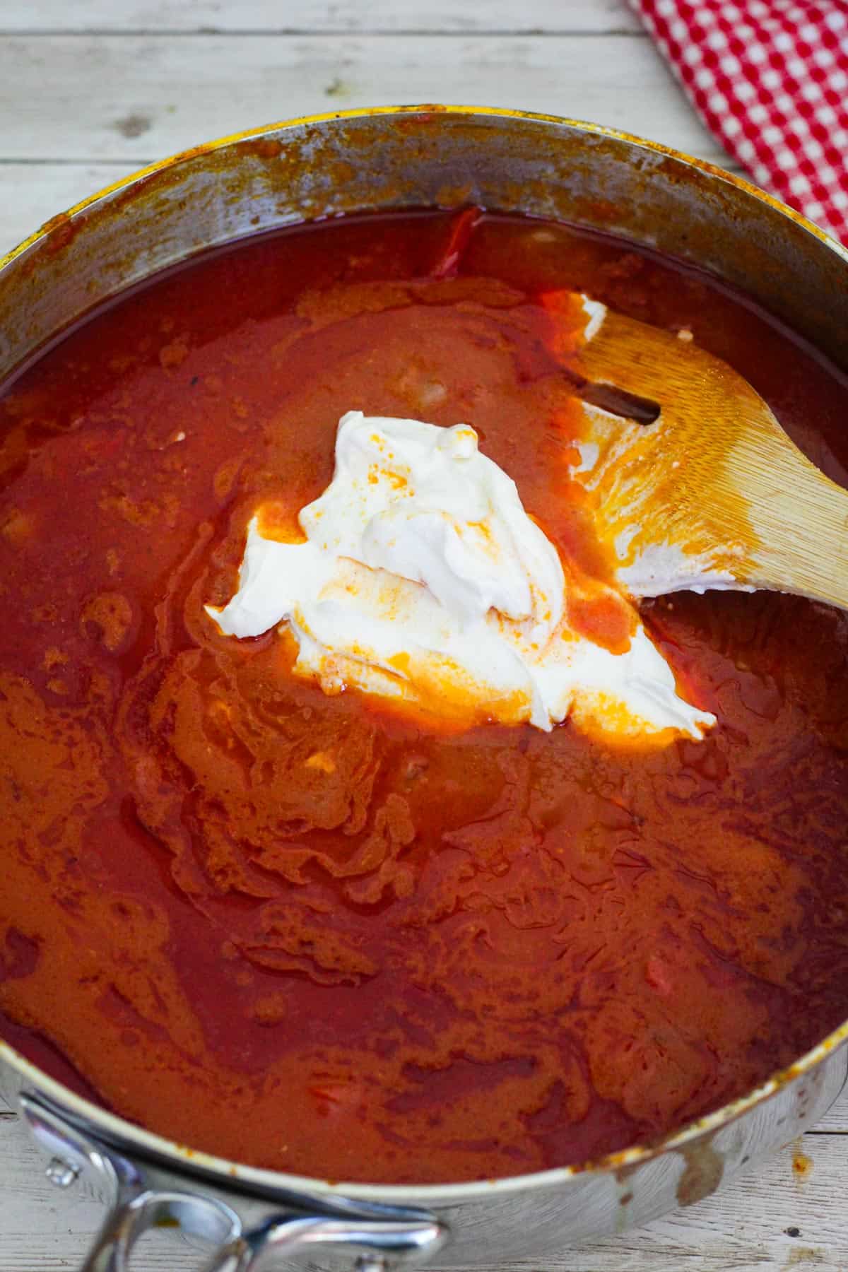 Sauce is in the skillet but not the chicken. Sauce looks way darker, and there's few tablespoons of sour cream added on. 