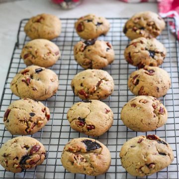 Butter pecan cookies, just baked shown on a cooling rack in rows.