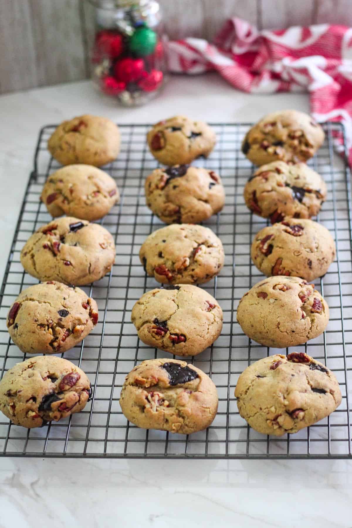 Baked butter pecan cookies cooling on a rack.