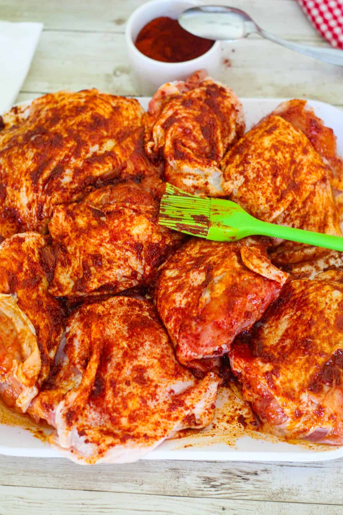 Seasoned chicken pieces with paprika. 